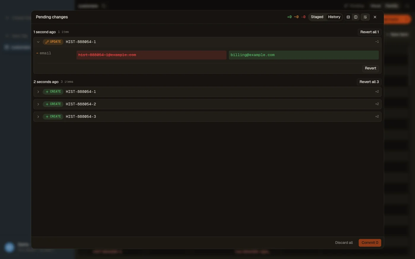 The History tab of DynoTable's staging panel: committed DynamoDB writes grouped by commit, each with its per-attribute before/after diff and a Revert action.