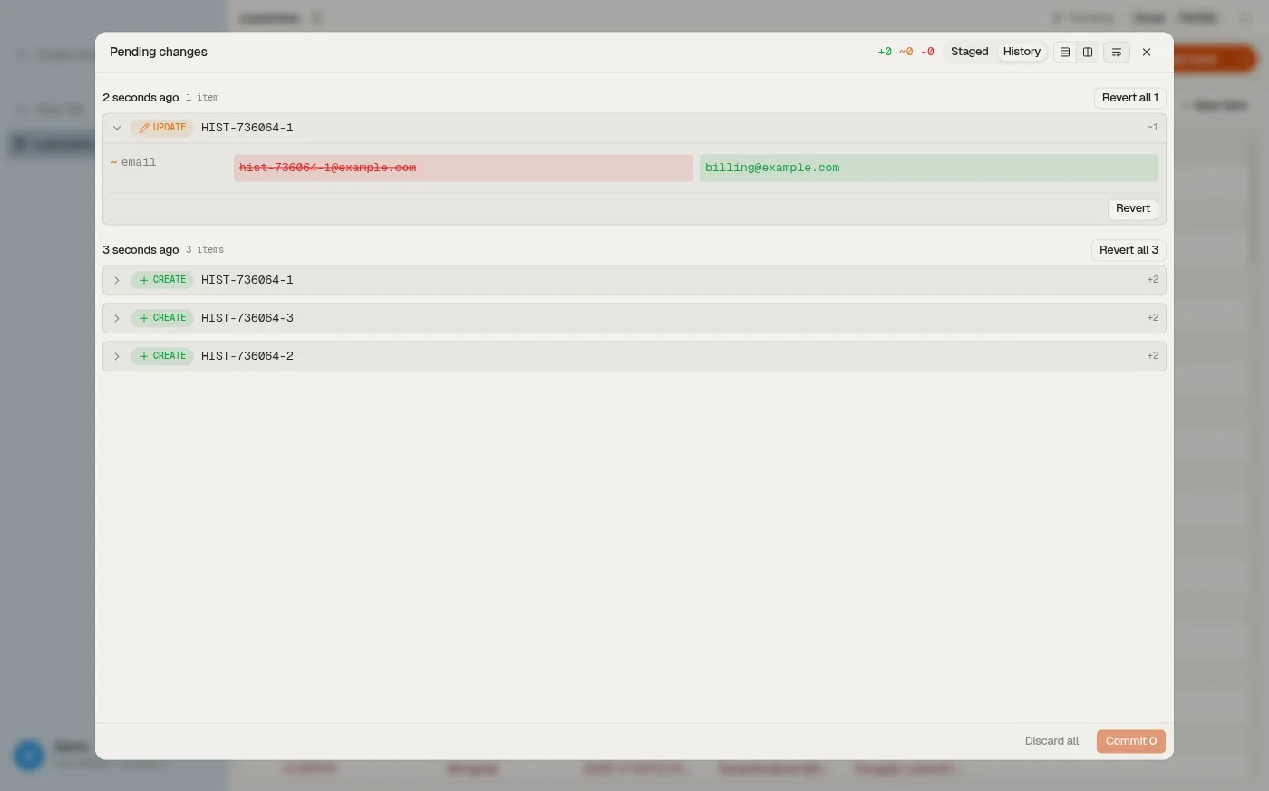 The History tab of DynoTable's staging panel: committed DynamoDB writes grouped by commit, each with its per-attribute before/after diff and a Revert action.