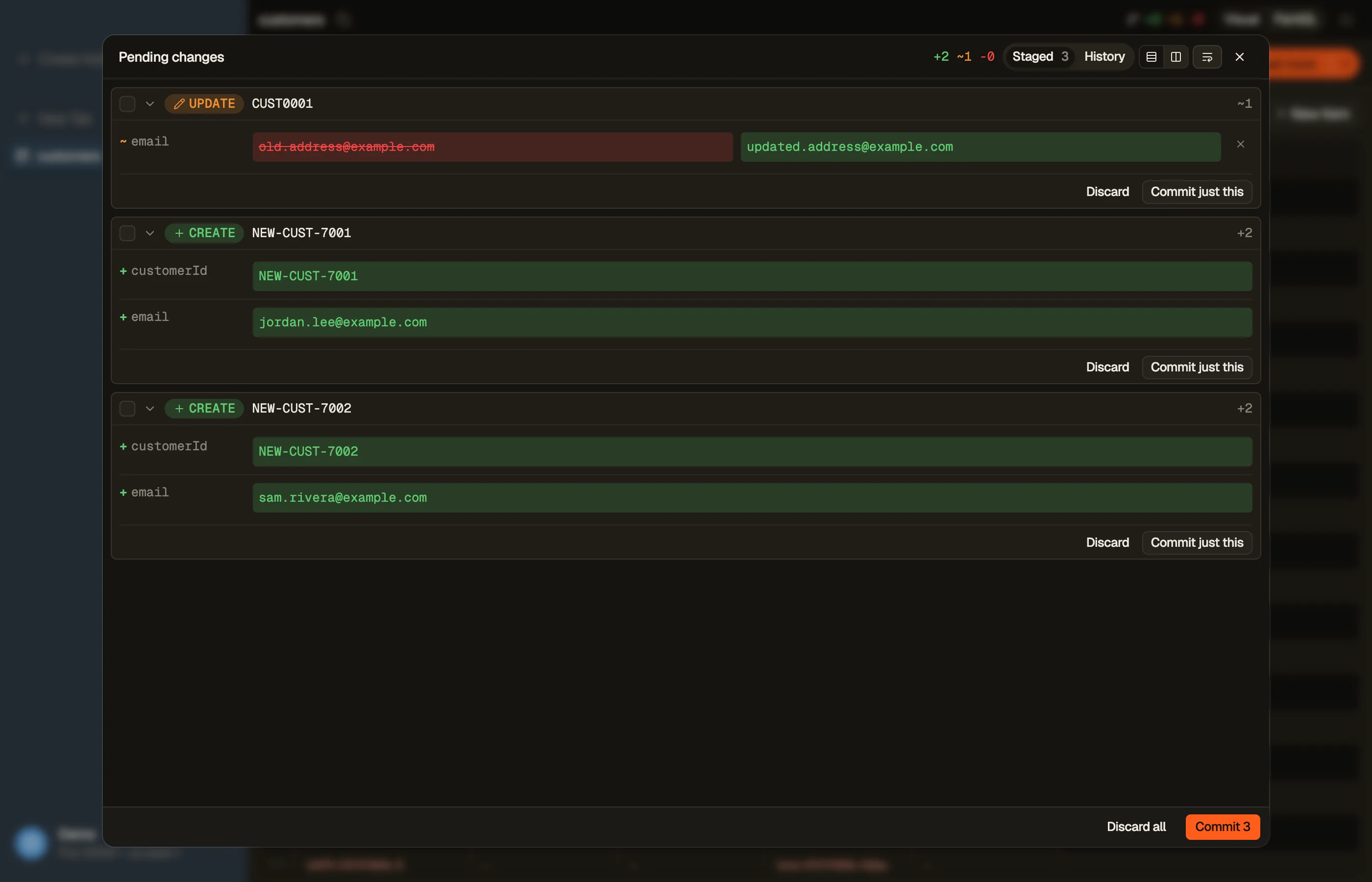 DynoTable's staging panel showing pending DynamoDB changes as per-attribute diff cards, with per-row and bulk commit.
