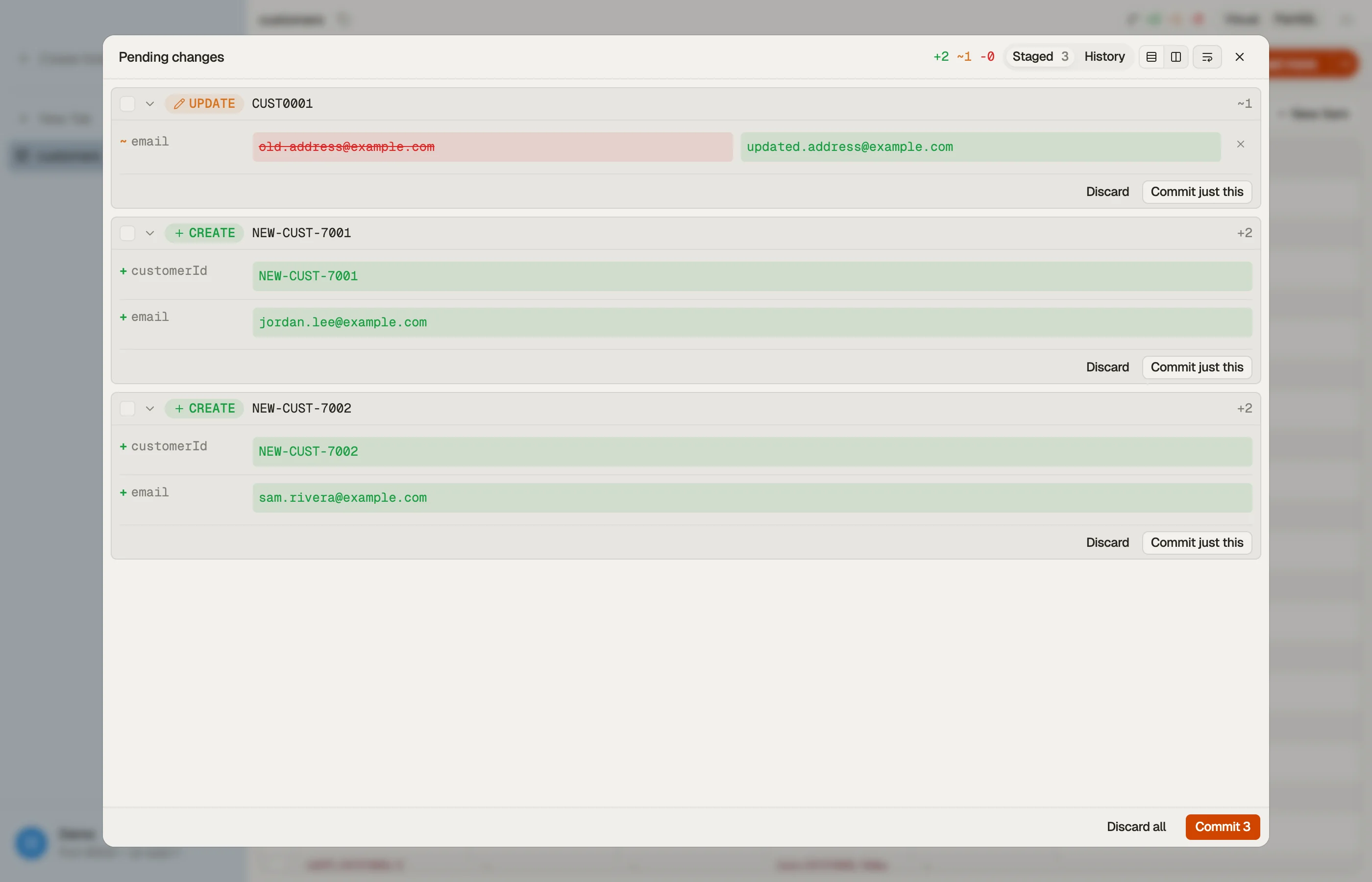 DynoTable's staging panel showing pending DynamoDB changes as per-attribute diff cards, with per-row and bulk commit.