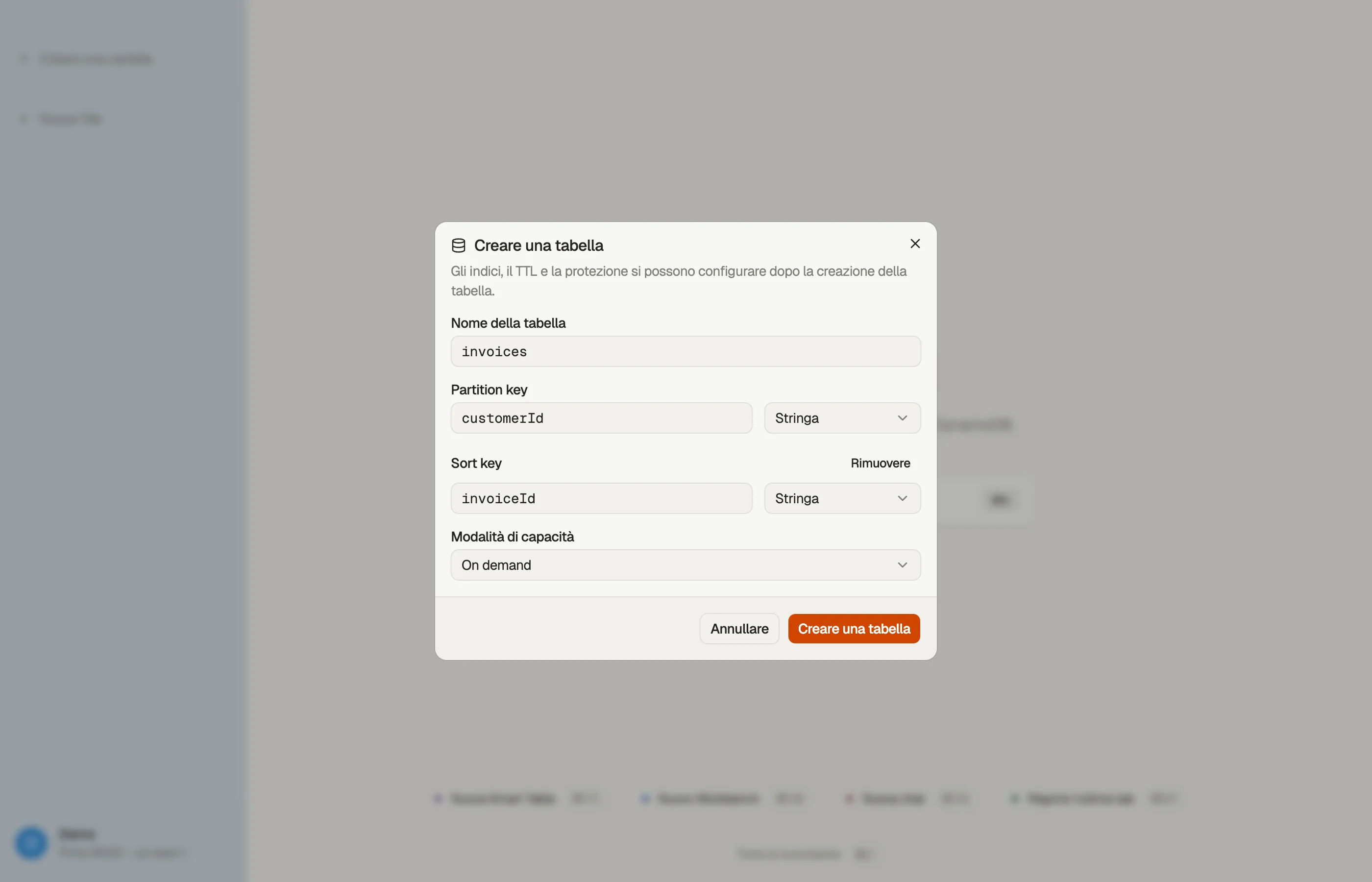 La finestra di dialogo Create table di DynoTable: il nome della tabella, una chiave di partizione e una chiave di ordinamento con i loro tipi di attributo e la scelta tra capacità on-demand e con provisioning.