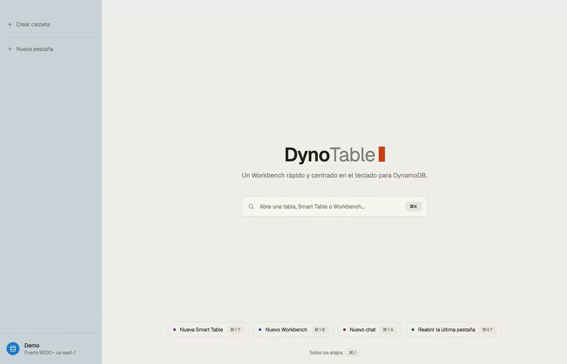 La GUI de DynamoDB de DynoTable en su pantalla de inicio: una barra ⌘K para abrir una tabla, una Smart Table o un workbench, con el perfil activo y la región anclados en la barra lateral.